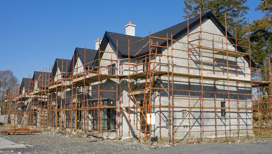 Scaffolding around a row of houses